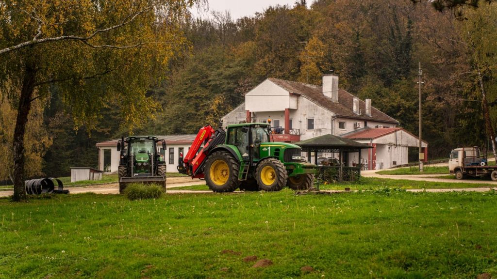 Tractor parked on a rustic farm in the countryside of Garešnica, Croatia during fall.