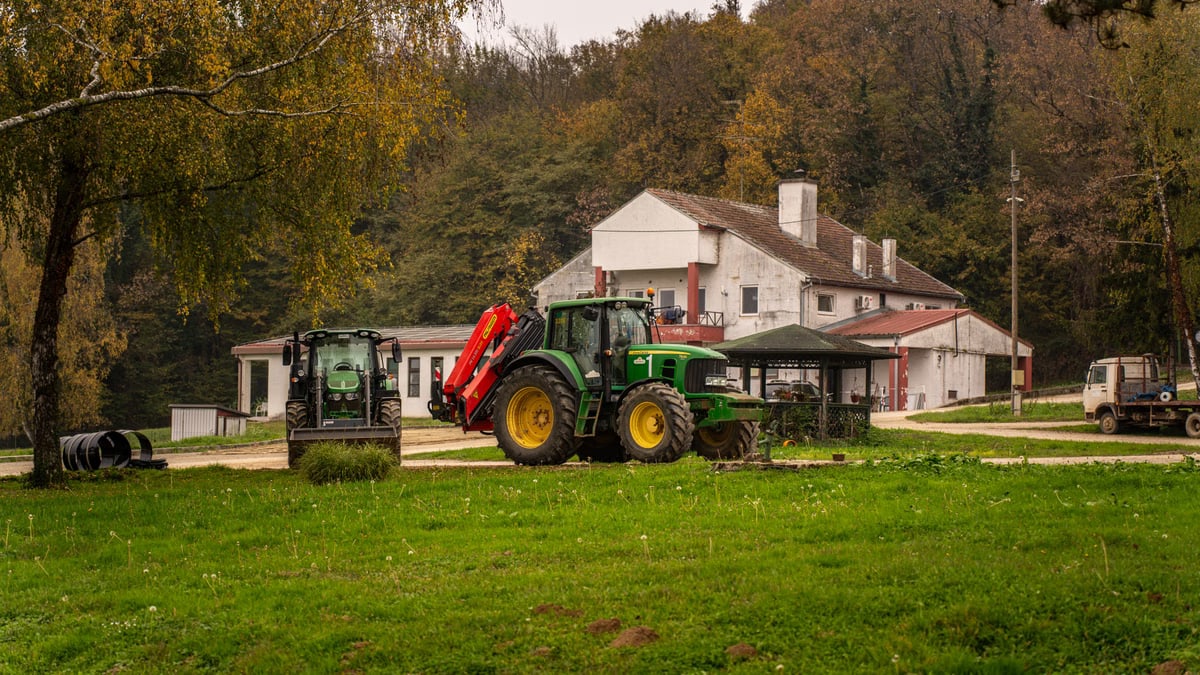 Tractor parked on a rustic farm in the countryside of Garešnica, Croatia during fall.